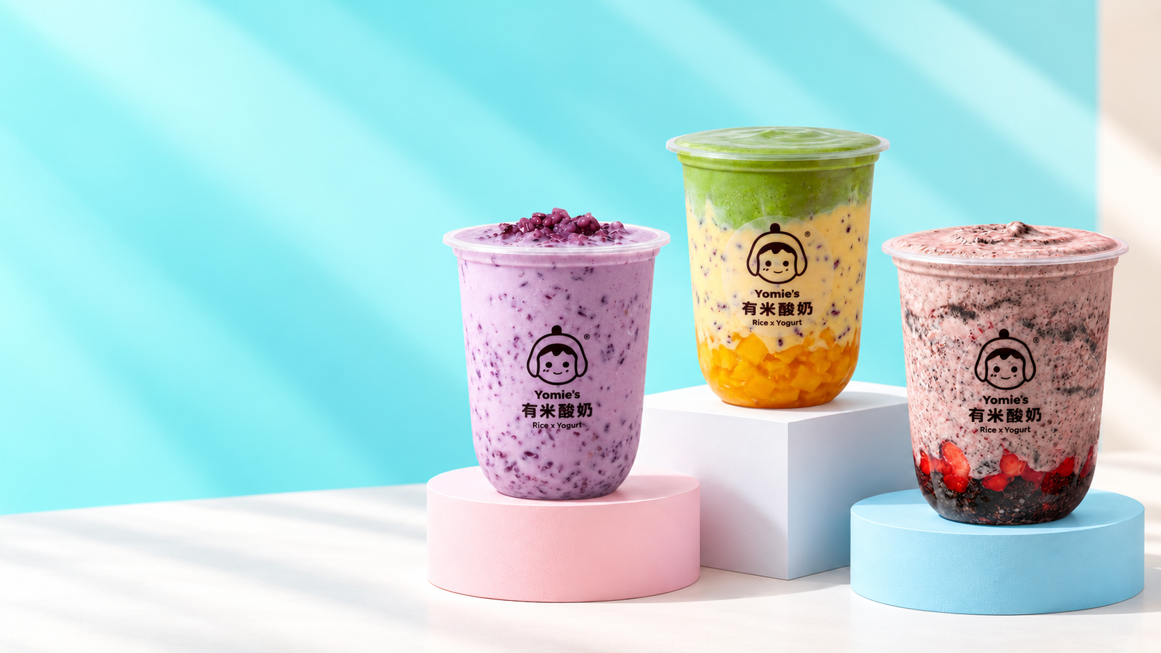 Three Yomie's yogurt drinks: taro purple rice, mango matcha, and strawberry Oreo